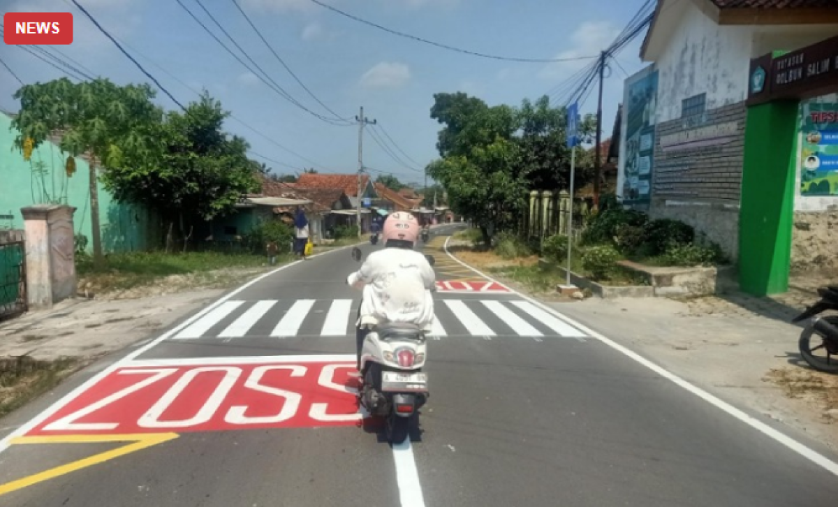 Jalan Cibadak-Padasuka Kini Berwajah Baru dengan Cat Jalan dan Rambu Lalu Lintas